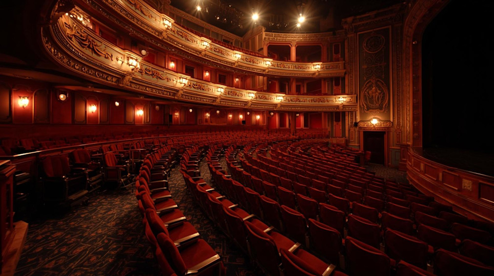 Wheelchair-accessible seating platform overlooking a packed arena floor